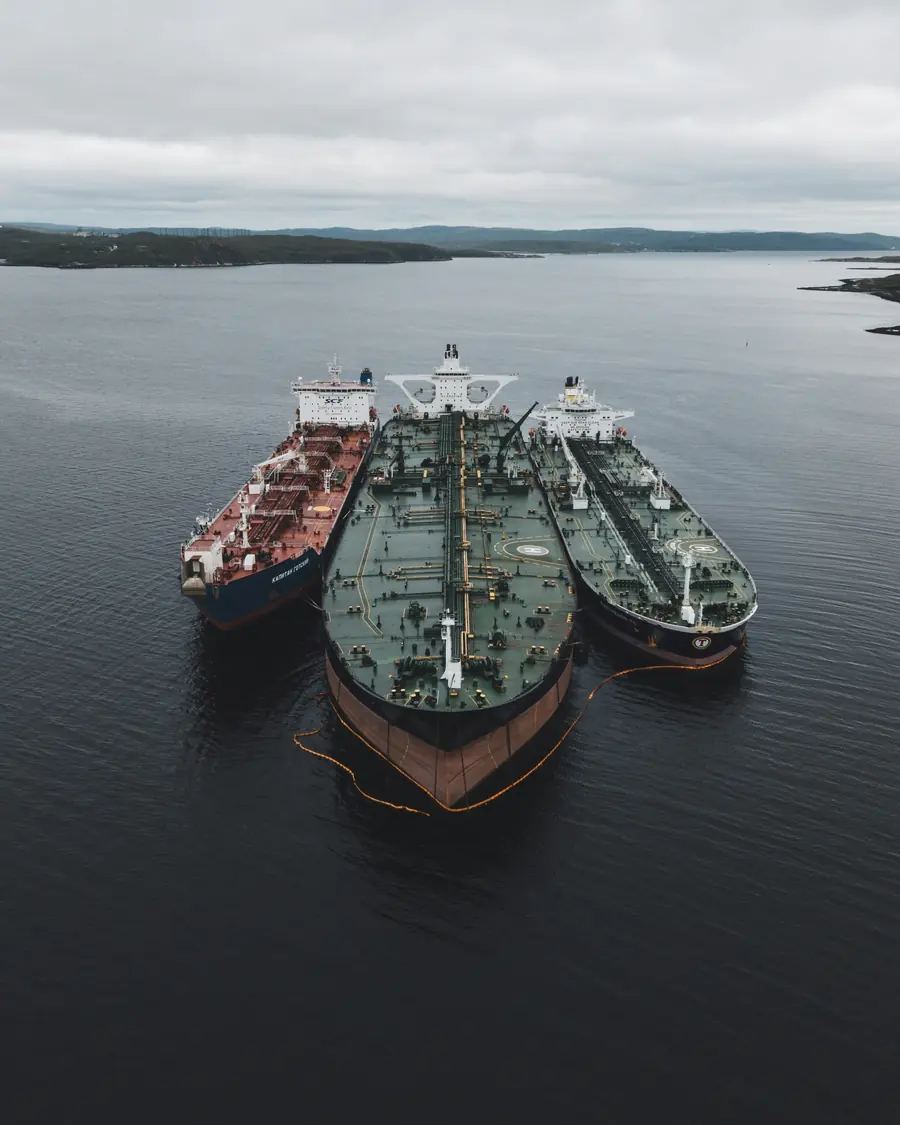 Three crude oil tankers moored alongside one another at sea