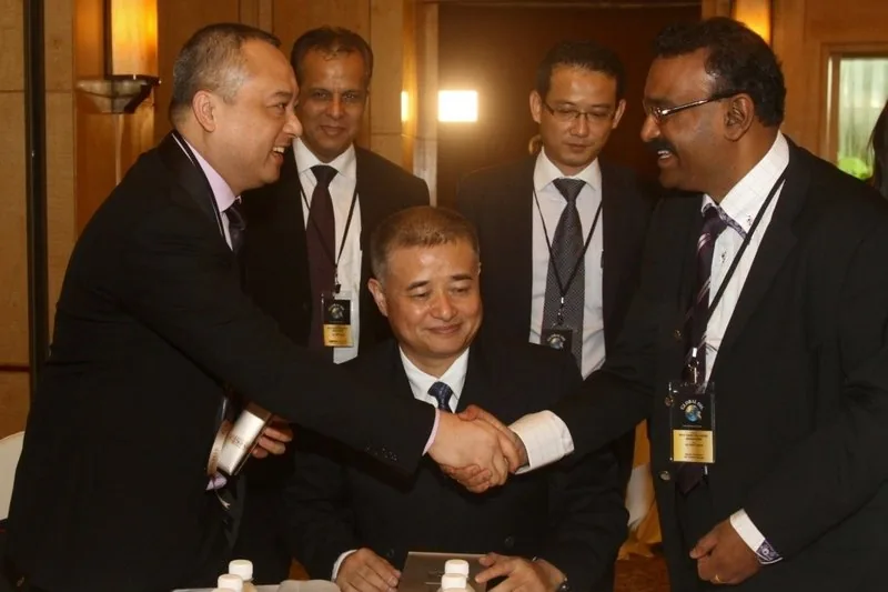 Delegates shaking hands at an international business meeting